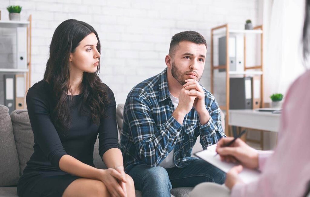 Couple receiving legal advice from a solicitor in Dandenong during a family law consultation.
