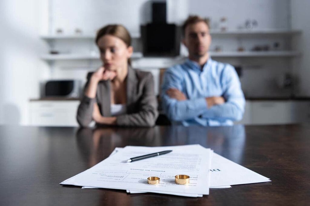 Navigating Property Settlements During Divorce: Your Essential Guide For Melbourne Residents 1 Melbourne Couple Dealing With Divorce And Property Settlement Documents.