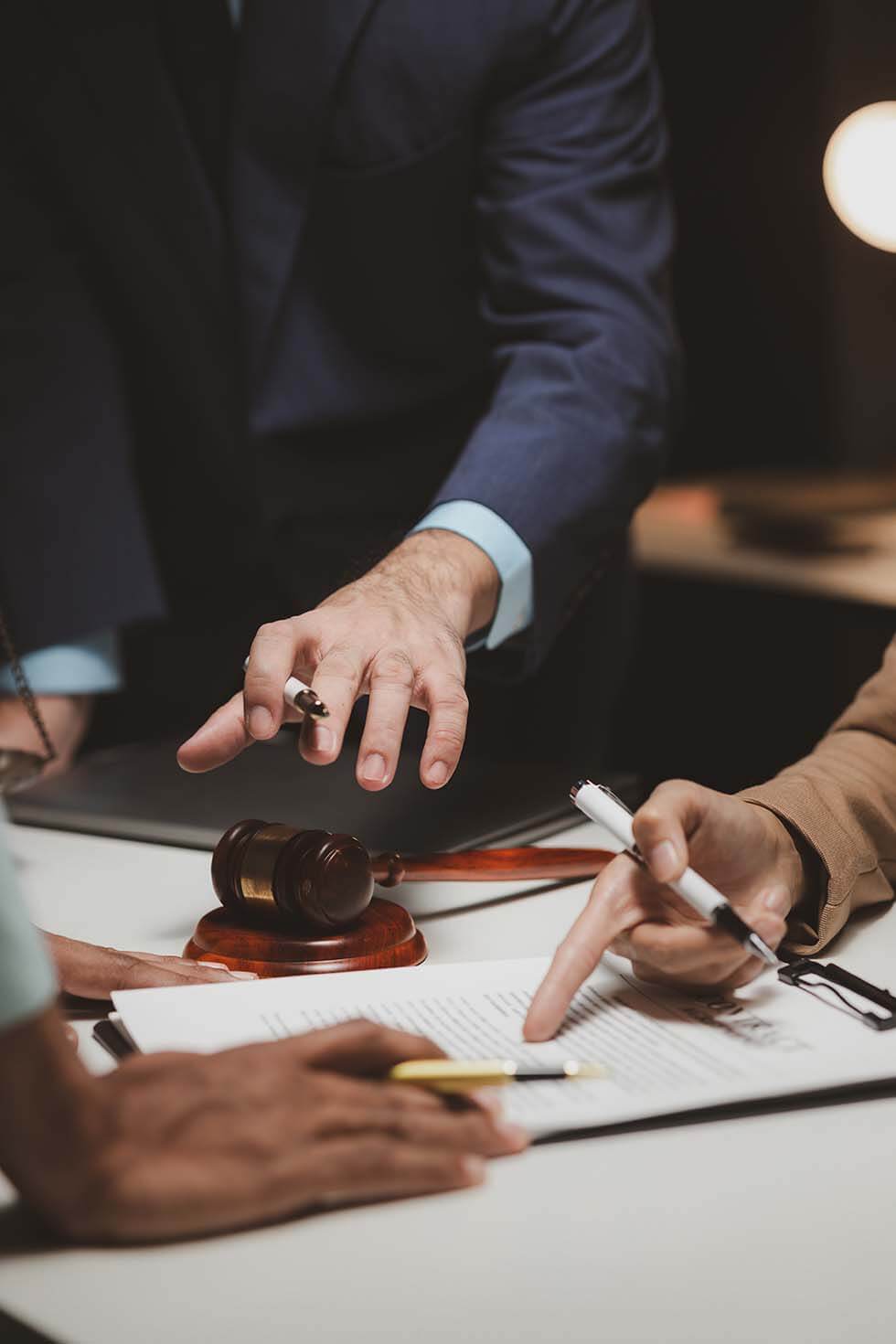 Commercial Lawyers Melbourne 9 Business Professionals Discussing Legal Documents In A Meeting