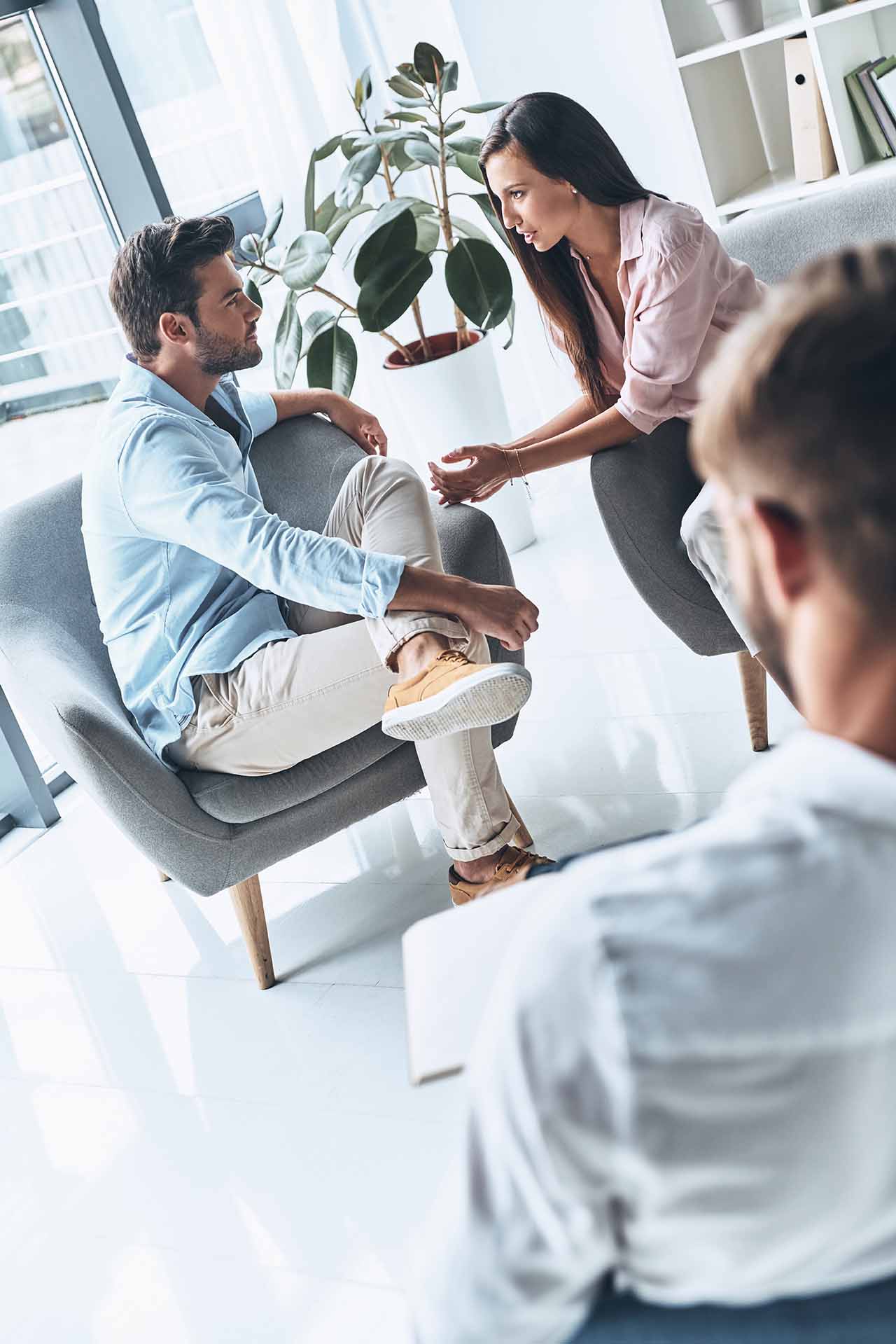 Separation And Divorce 6 Man And Woman Having A Serious Discussion With A Third Person During A Counselling Or Legal Consultation.