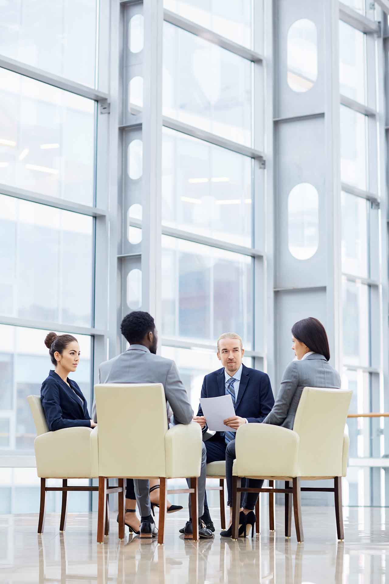 Employment Lawyers In Melbourne 1 A Diverse Group Of Professionals Meeting In A Modern Melbourne Office, Symbolising Collaboration And Expert Guidance In Employment Law Matters.